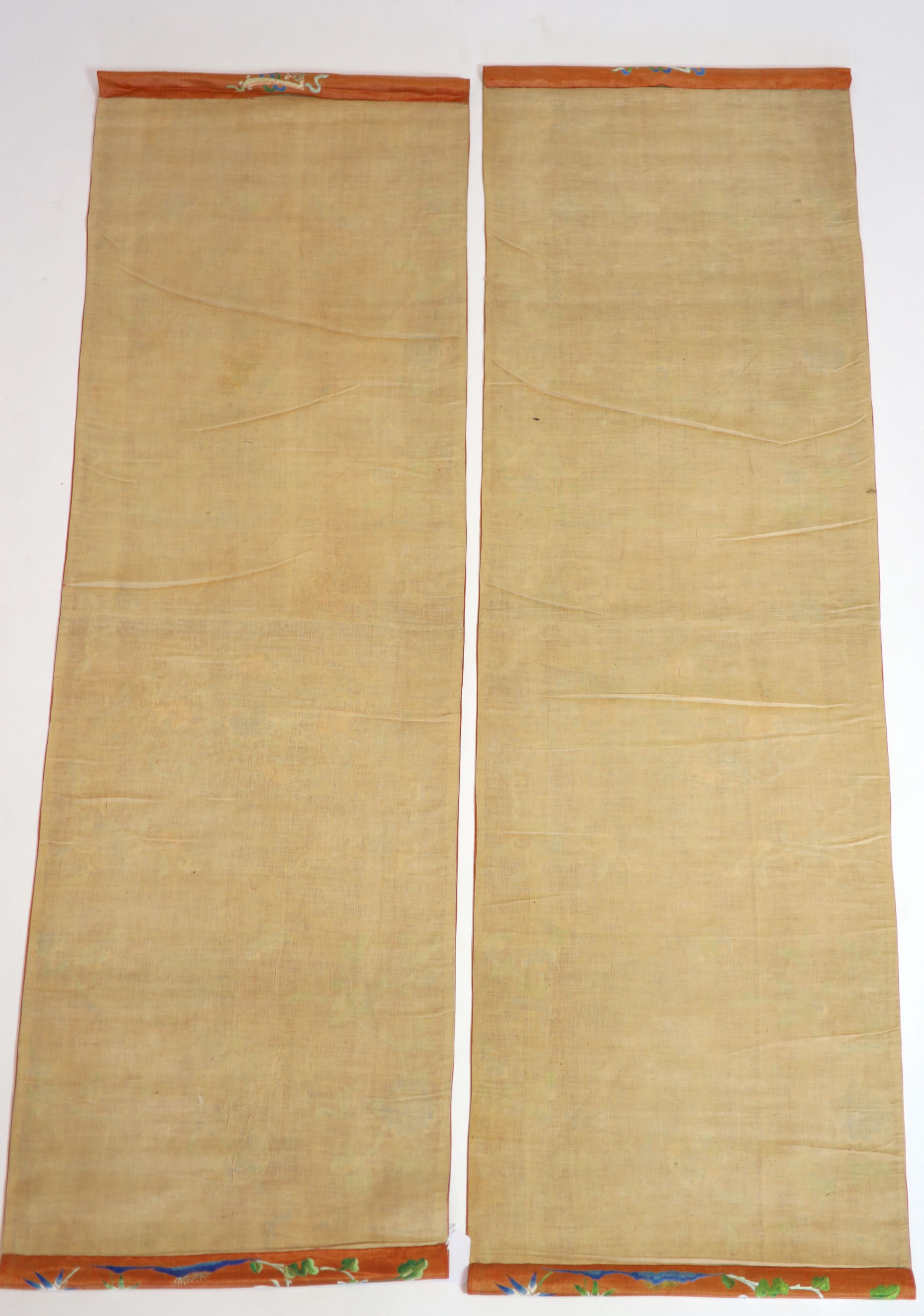 A pair of Chinese peach silk embroidered hangings, 19th century 137 x 44 cm